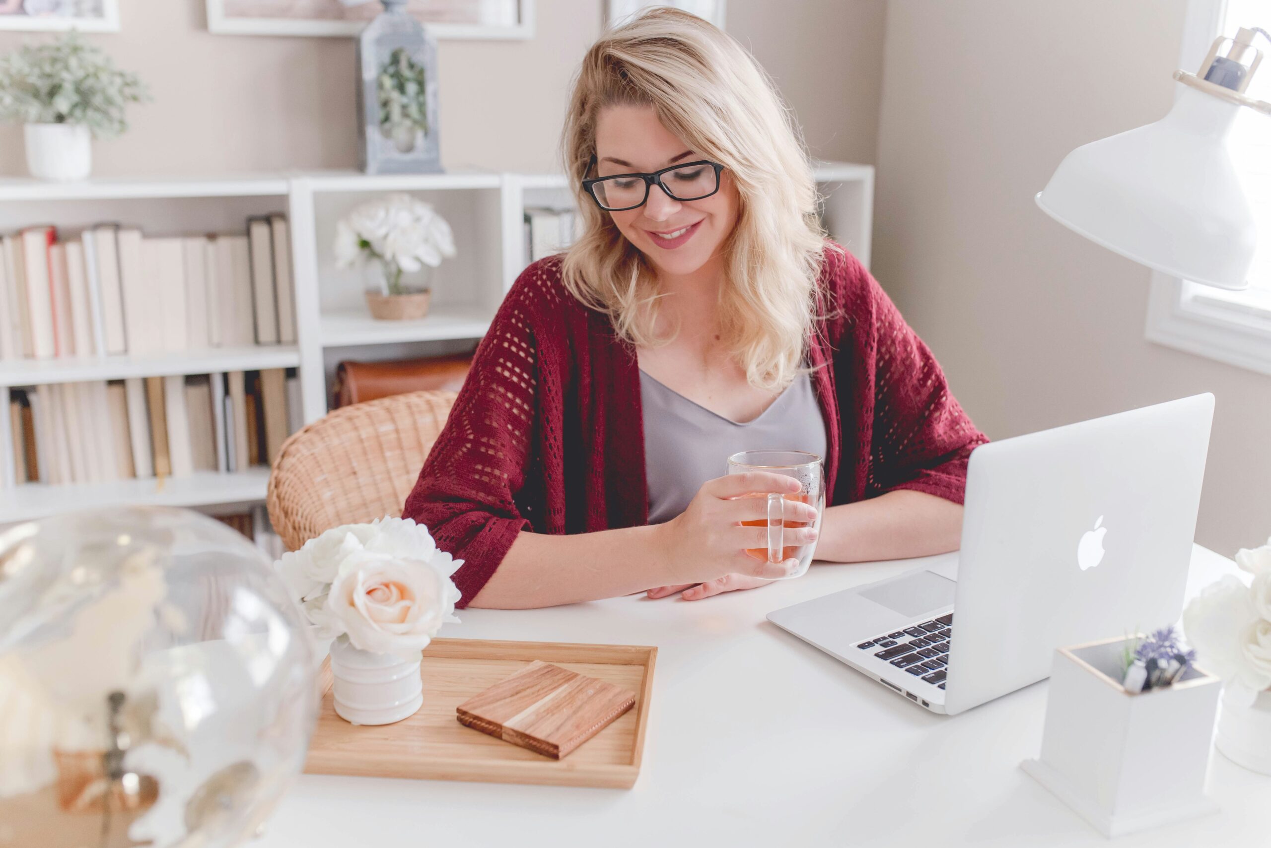 Business owner working calmly at a laptop representing organised support and control